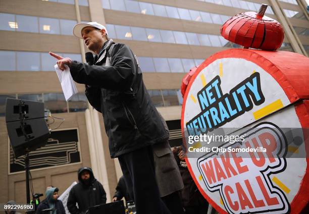 Sen. Ron Wyden addresses protesters outside the Federal Communication Commission building to rally against the end of net neutrality rules December...