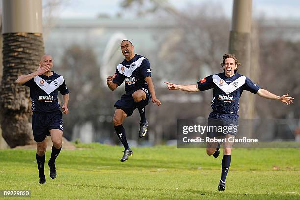 Kevin Muscat, Archie Thompson and Nick Ward of the Victory are seen during the Melbourne Victory A-League television commercial shoot at Albert Park...