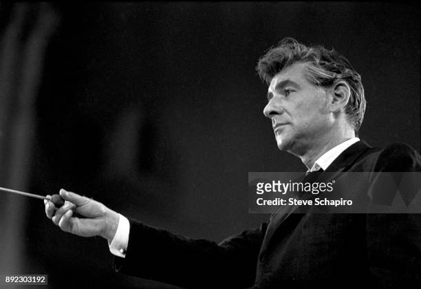 View of American composer, musician, and conductor Leonard Bernstein as he conducts at Carnegie Hall, New York, New York, 1959.