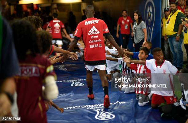 Brazil's Flamengo player Vinicius Jr. Greets children before the Copa Sudamericana football final against Argentina's Independiente at the Maracana...