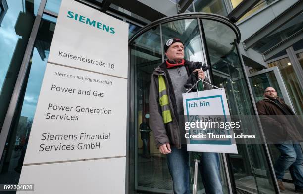 Employees of German engineering giant Siemens leave the local facility for a demonstration on December 14, 2017 in Offenbach, Germany. Siemens...