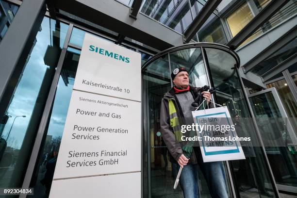 Employees of German engineering giant Siemens leave the local facility for a demonstration on December 14, 2017 in Offenbach, Germany. Siemens...