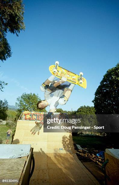 Rob Washburn does an invert over the channel of the Cito Ramp, a backyard half pipe, in March 1985 in Montecito, California.