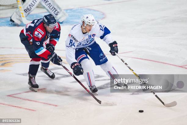 Kevin Hecquefeuille of France is challenged by Matej Paulovic of Slovakia during their MECA Hockey Games ice hockey match in Hamar, Norway, on...