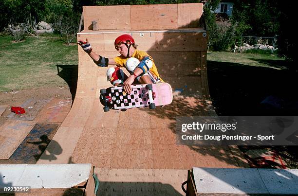 John Dettman does a frontside air over the channel of the Cito Ramp, a backyard half pipe, in March 1985 in Montecito, California.