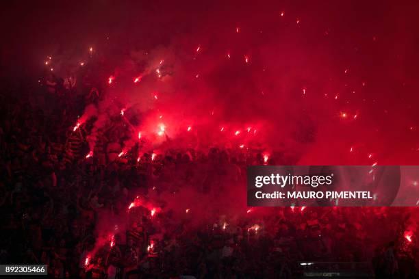 Brazil's Flamengo supporters light flares before the Copa Sudamericana football final against Argentina's Independiente at the Maracana stadium in...