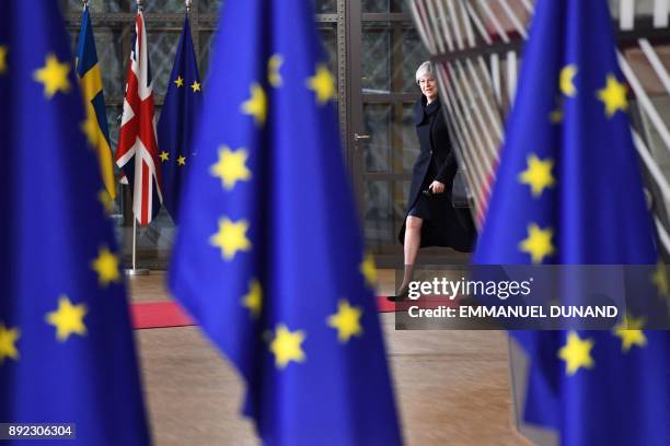Britain's Prime minister Theresa May arrives to attend the first day of a European union summit in Brussels on December 14, 2017. European leaders...