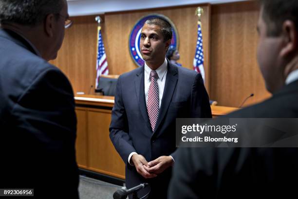 Ajit Pai, chairman of the Federal Communications Commission , greets presenters during an open commission meeting in Washington, D.C., U.S., on...