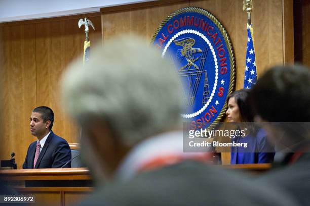 Ajit Pai, chairman of the Federal Communications Commission , left, and Jessica Rosenworcel, commissioner at the FCC, right, listen during an open...