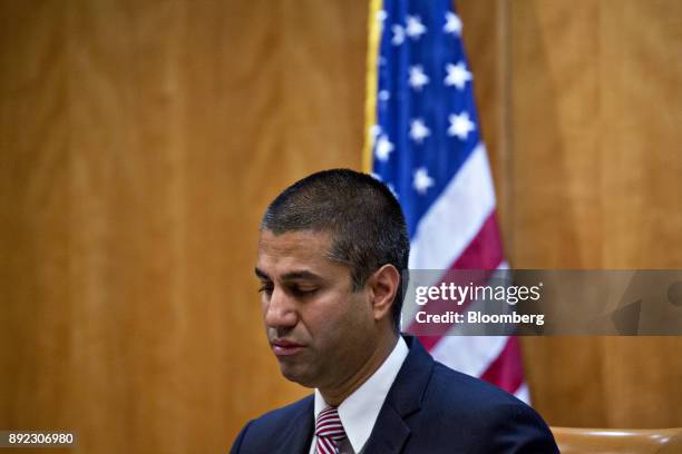 Ajit Pai, chairman of the Federal Communications Commission , listens during an open commission meeting in Washington, D.C., U.S., on Thursday, Dec....