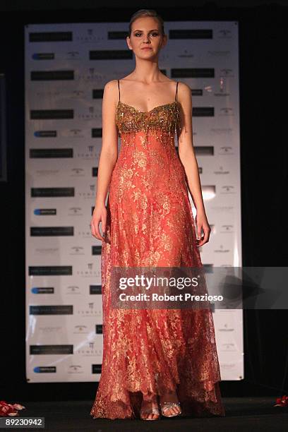 Model showcases a 'Cappellazzo Couture' outfit at the official unveiling of the Australian national costume and wardrobe for Miss Universe at Park...