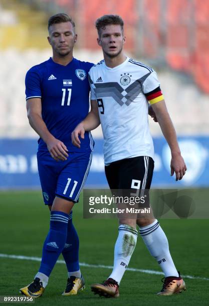 Eric Hottmann of Germany in action with Eden Karzev of Israel during the U18 final match at the Winter Tournament on December 14, 2017 in Ramat Gan,...