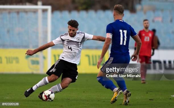 Jose Enrique Rios of Germany in action with Eden Karzev of Israel during the U18 final match at the Winter Tournament on December 14, 2017 in Ramat...