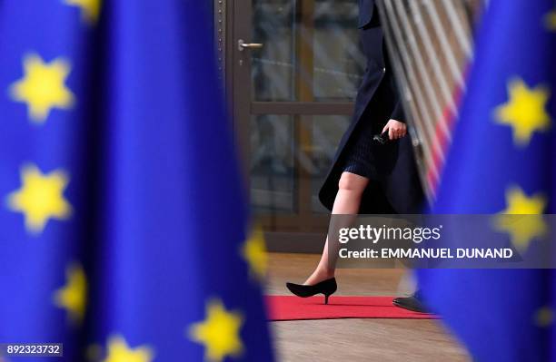 Britain's Prime minister Theresa May arrives to attend the first day of a European union summit in Brussels on December 14, 2017. European leaders...