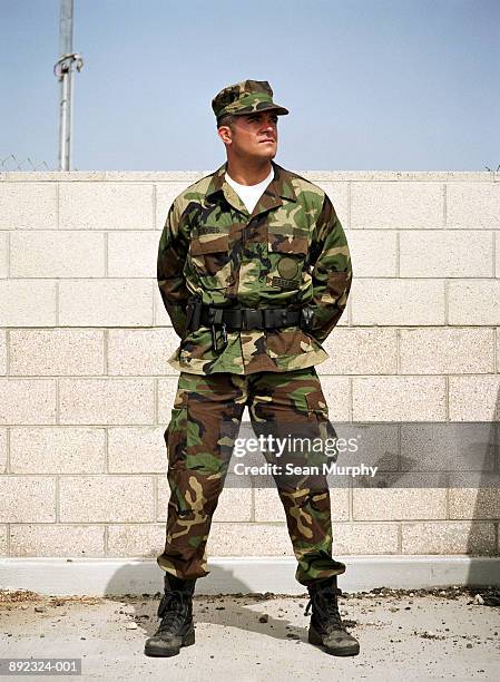 soldier standing gaurd at military base - military base foto e immagini stock