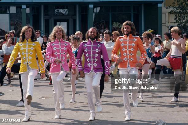 View of, fore from left, musicians Robin Gibb , Peter Frampton , and Maurice & Barry Gibb in a scene from the film 'Sgt Pepper's Lonely Hearts Club...