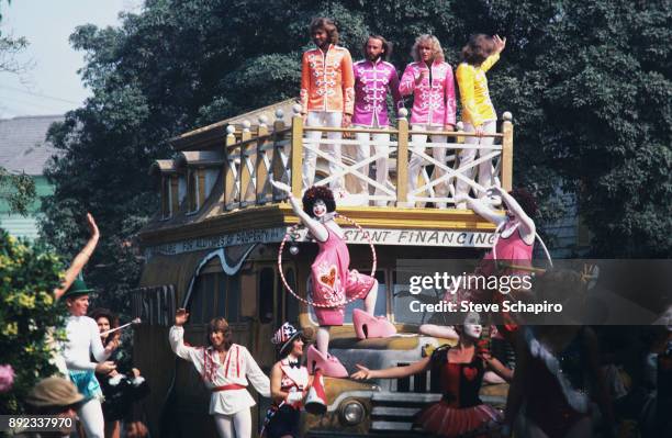 View of, atop bus from left, musicians Barry and Maurice Gibb , Peter Frampton , and Robin Gibb in a scene from the film 'Sgt Pepper's Lonely Hearts...