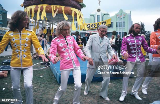 View of, from left, musicians Robin Gibb and Peter Frampton , comedian George Burns , and musicians Maurice and Barry Gibb in the film 'Sgt Pepper's...