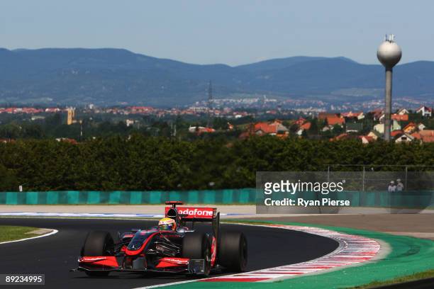 Lewis Hamilton of Great Britain and McLaren Mercedes drives during practice for the Hungarian Formula One Grand Prix at the Hungaroring on July 24,...