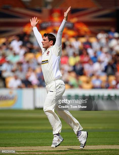 David Wigley of Northamtonshire celebrates taking the wicket of Phillip Hughes of Australia during the tour match between Northamptonshire and...