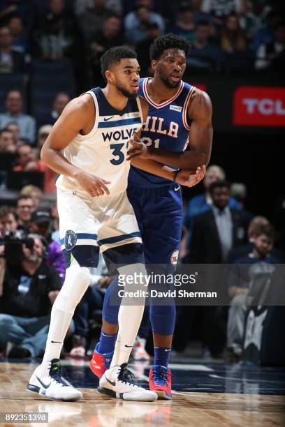 Joel Embiid of the Philadelphia 76ers guards Karl-Anthony Towns of the Minnesota Timberwolves during the game on December 12, 2017 at Target Center...