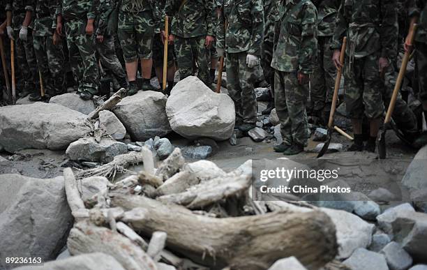 Paramilitary policemen prepare for rescue work after a landslide on July 24, 2009 in Kangding County of Ganzi Tibetan Autonomous Prefecture, Sichuan...