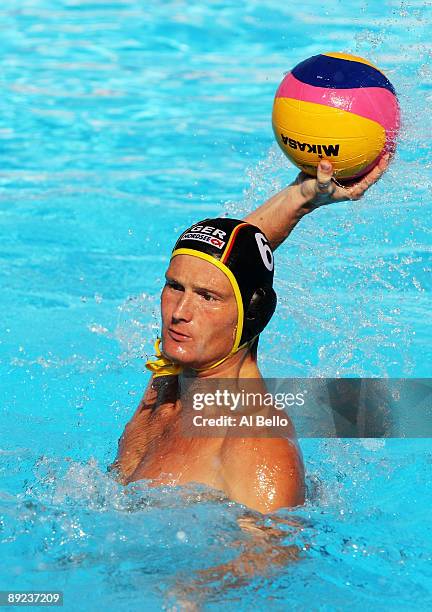 Marc Politze of Germany competes in the Men's Water Polo preliminary round between Canada and Germany during the 13th FINA World Championships at the...