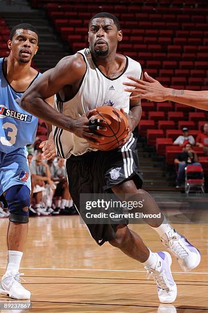 Tyreke Evans of the Sacramento Kings drives to the basket past Trey Johnson of the NBA D-League Select team during NBA Summer League presented by EA...