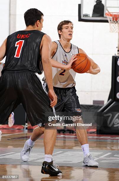 Goran Dragic of the Phoenix Suns looks to pass against Roko Ukic of the Toronto Raptors during NBA Summer League presented by EA Sports on July 15,...
