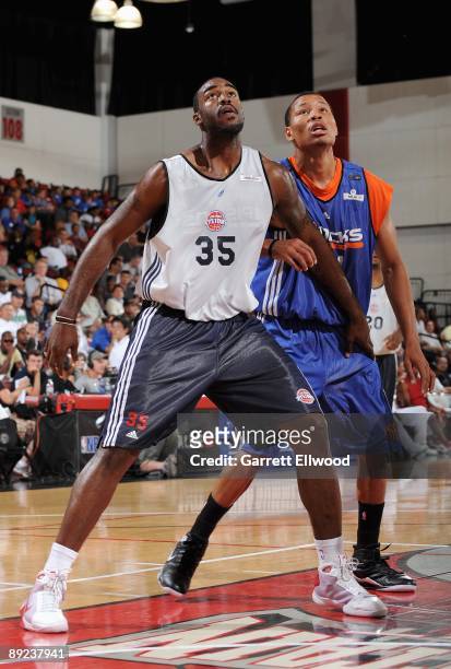 DaJuan Summers of the Detroit Pistons boxes out Alex Acker of the New York Knicks during NBA Summer League presented by EA Sports on July 15, 2009 at...