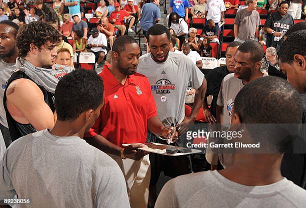 Assistant coach Adrian Griffin of the Milwaukee Bucks draws up a play against the Chicago Bulls during NBA Summer League presented by EA Sports on...