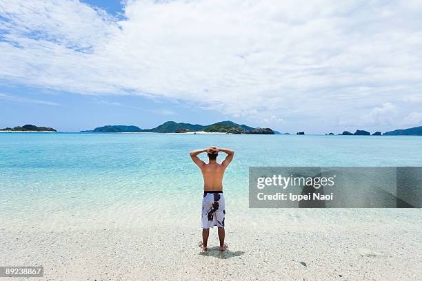 man looking at the deserted japanese islands - einsame insel stock-fotos und bilder