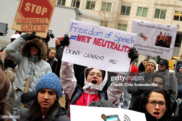 Demonstrators rally outside the Federal Communication Commission building to protest against the end of net neutralityrules December 14, 2017 in...