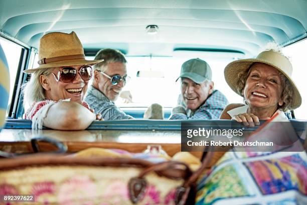 a group of friends on a road trip to the beach - senior public transportation stock pictures, royalty-free photos & images