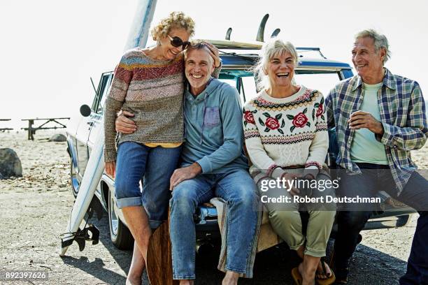 a group of friends on a road trip to the beach - 55 60 years stock pictures, royalty-free photos & images