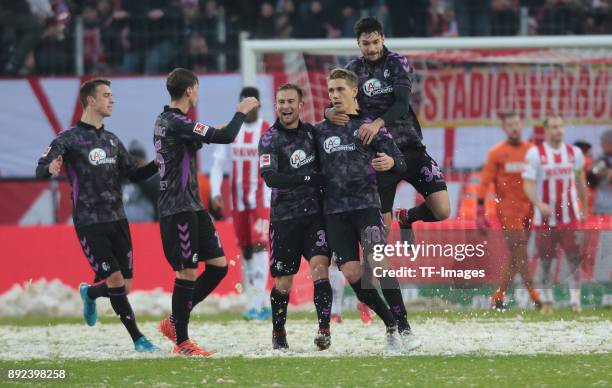 Nils Petersen of Freiburg celebrates after scoring a goal with Yoric Ravet of Freiburg, Pascal Stenzel of Freiburg, Caleb Stanko of Freiburg and Tim...