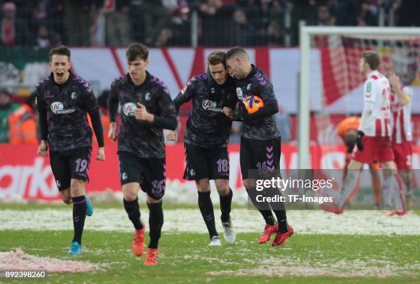 Nils Petersen of Freiburg celebrates after scoring a goal with Janik Haberer of Freiburg, Pascal Stenzel of Freiburg and Yoric Ravet of Freiburg...