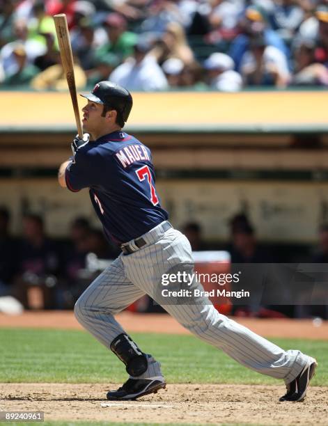 Joe Mauer of the Minnesota Twins bats against the Oakland Athletics during the game at the Oakland-Alameda County Coliseum on July 22, 2009 in...