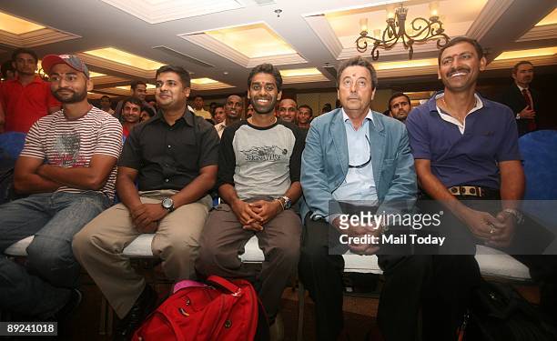 Chief coach of the Indian hockey team Jose Brasa poses with the team after unveiling the new team logo in New Delhi on Thursday, July 23, 2009. A...