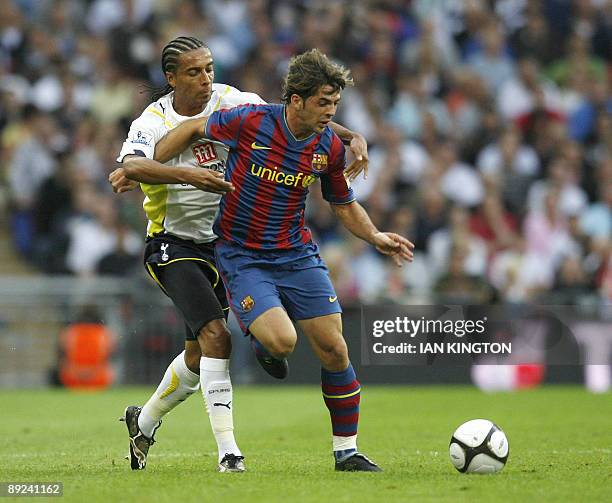 Barcelona's Victor Sanchez vies with Tottenham Hotspurs Cameroon player Benoit Assou-Ekotto during the Wembley Cup competition at Wembley Stadium in...
