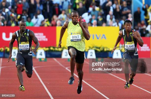 Usain Bolt of Jamaica outsprints Daniel Bailey of Antigua and Yohan Blake of Jamaica in the Men's 100m Final during day one of the Aviva London Grand...