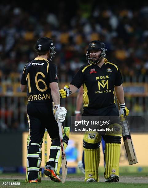 Paul Stirling of Kerela Kings speaks to Eoin Morgan of Kerela Kings during the T10 League match between Bengal Tigers and Kerala Kings at Sharjah...