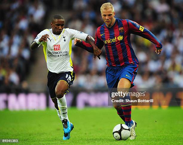 Jermain Defoe of Tottenham Hotspur closes down Eidur Gudjohnsen of Barcelona during the Wembley Cup match between Tottenham Hotspur and Barcelona at...