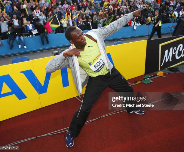 Usain Bolt of Jamaica celebrates as he wins the Men's 100 Metres Final during day one of the Aviva London Grand Prix track and field meeting at...