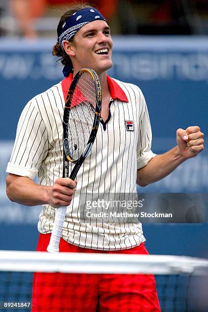 Frank Dancevic of Canada celebrates defeating Dmitry Tursonov of Russia during the Indianapolis Tennis Championships on July 24, 2009 at the...