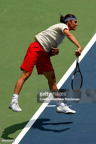 Frank Dancevic of Canada serves to Dmitry Tursonov of Russia during the Indianapolis Tennis Championships on July 24, 2009 at the Indianapolis Tennis...
