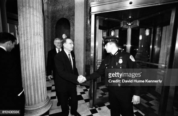 Republican Senator Strom Thurmond of South Carolina greets a Capitol policeman in the halls the U.S. Capitol Building on the first day of the Senate...