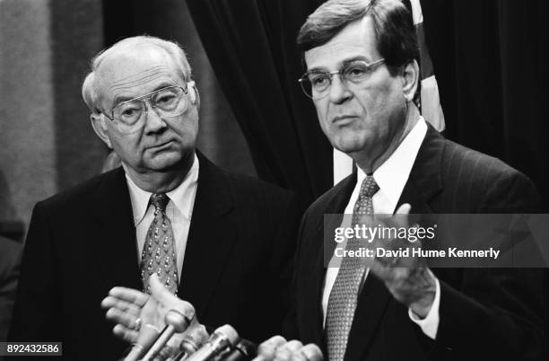 Senate Majority Leader Trent Lott and fellow Republican Sen. Phil Gramm of Texas talk to reporters in the hallways of the U.S. Capitol Building...