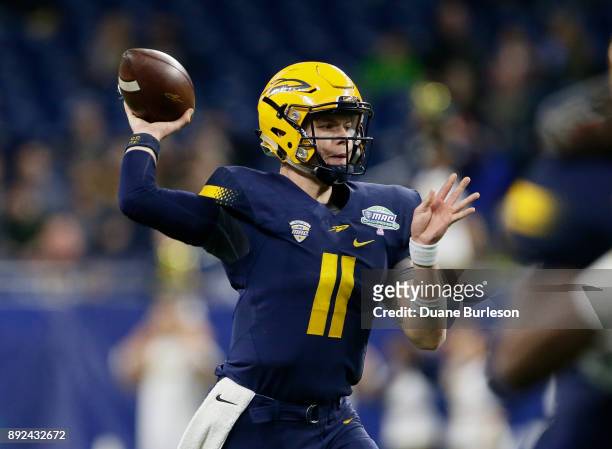 Quarterback Logan Woodside of the Toledo Rockets passes the ball against the Akron Zips during the first half at Ford Field on December 2, 2017 in...