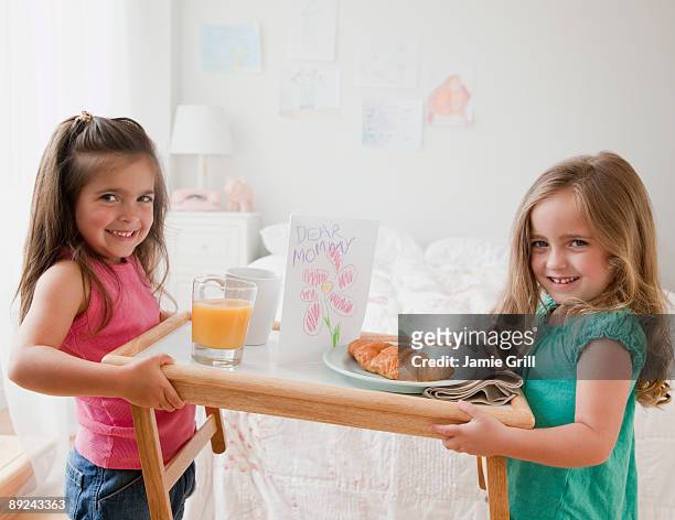 girls holding breakfast tray for their mom - platter side bildbanksfoton och bilder